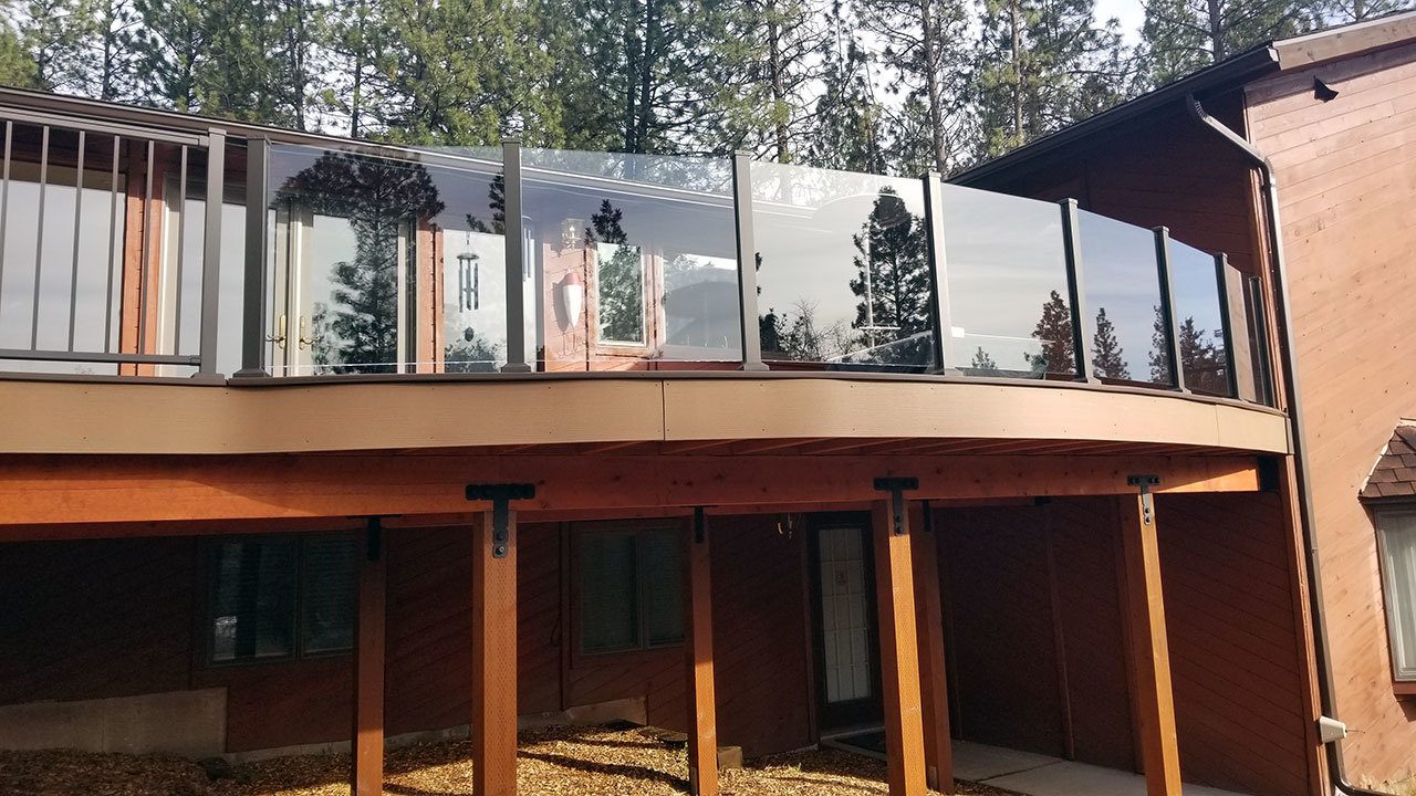 Glass deck railing on a custom deck