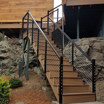 Custom stairs and railing up to deck in Spokane
