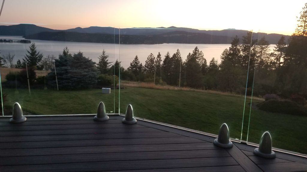 Custom clear view glass railing with up lighting in Spokane