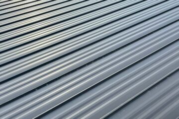 Black metal roof rib loc and tyvek.