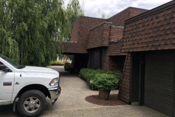 House sided with composite shingle roofing materials.